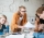 group-of-upset-students-sitting-at-the-table-with-E5YW9L4.jpg